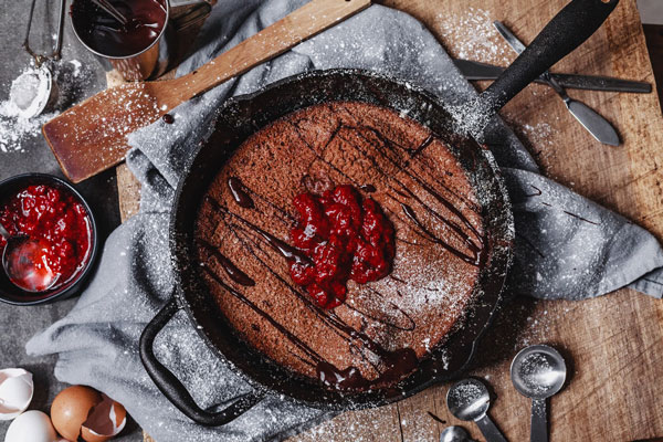 Chocolate Dutch Baby With Homemade Strawberry And Chocolate Sauce