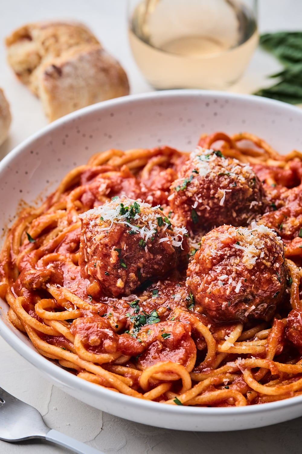 3 Spaghetti Meatballs in sauce on a plate close up
