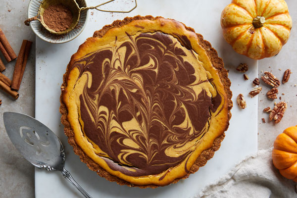 Marbled Chocolate Cheesecake Pumpkin Tart With A Biscoff Pecan Crust