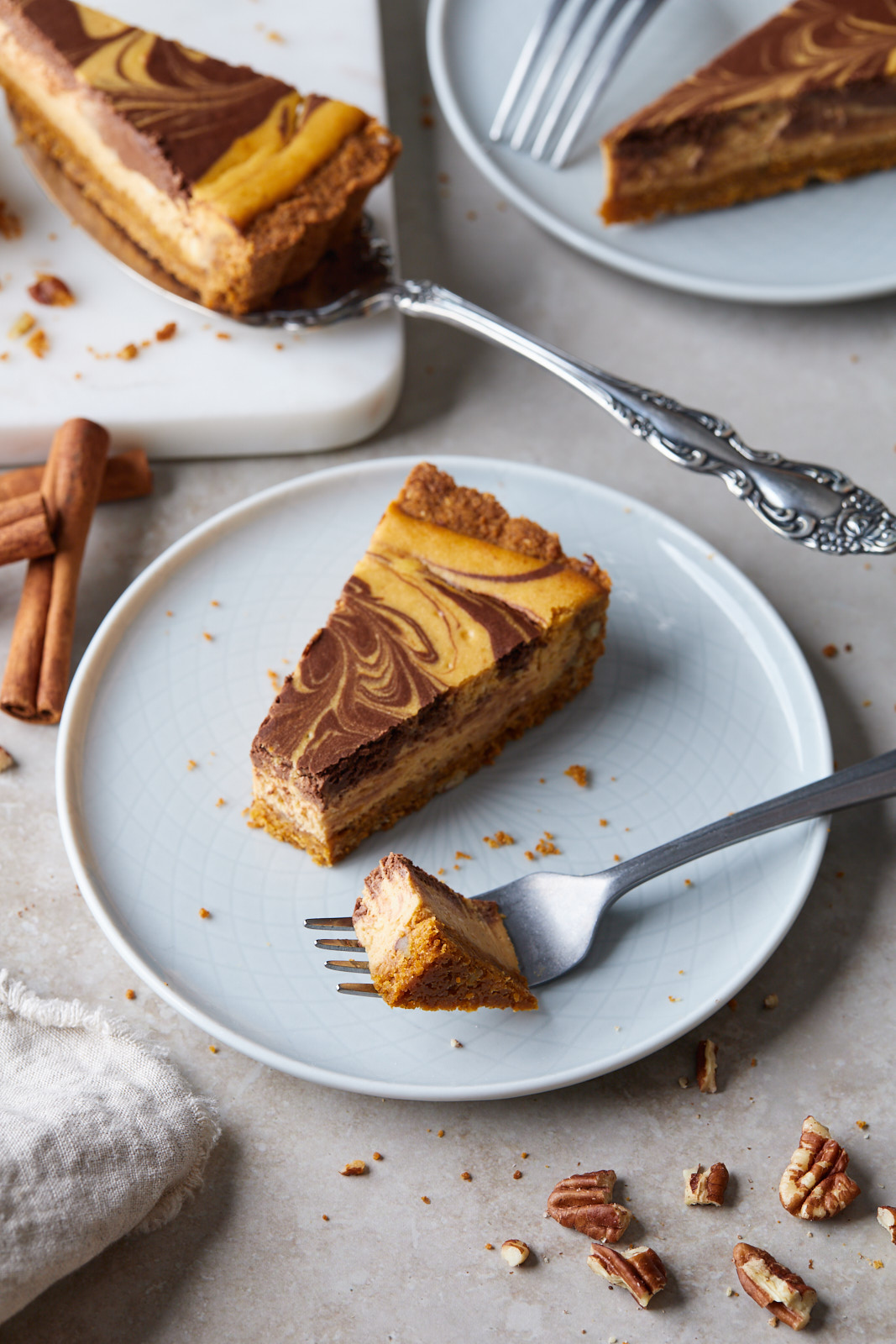 Marbled Chocolate Cheesecake Pumpkin Tart With A Biscoff Pecan Crust