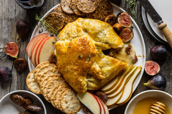 Baked Brie in Puffed Pastry With Honey Bourbon Figs