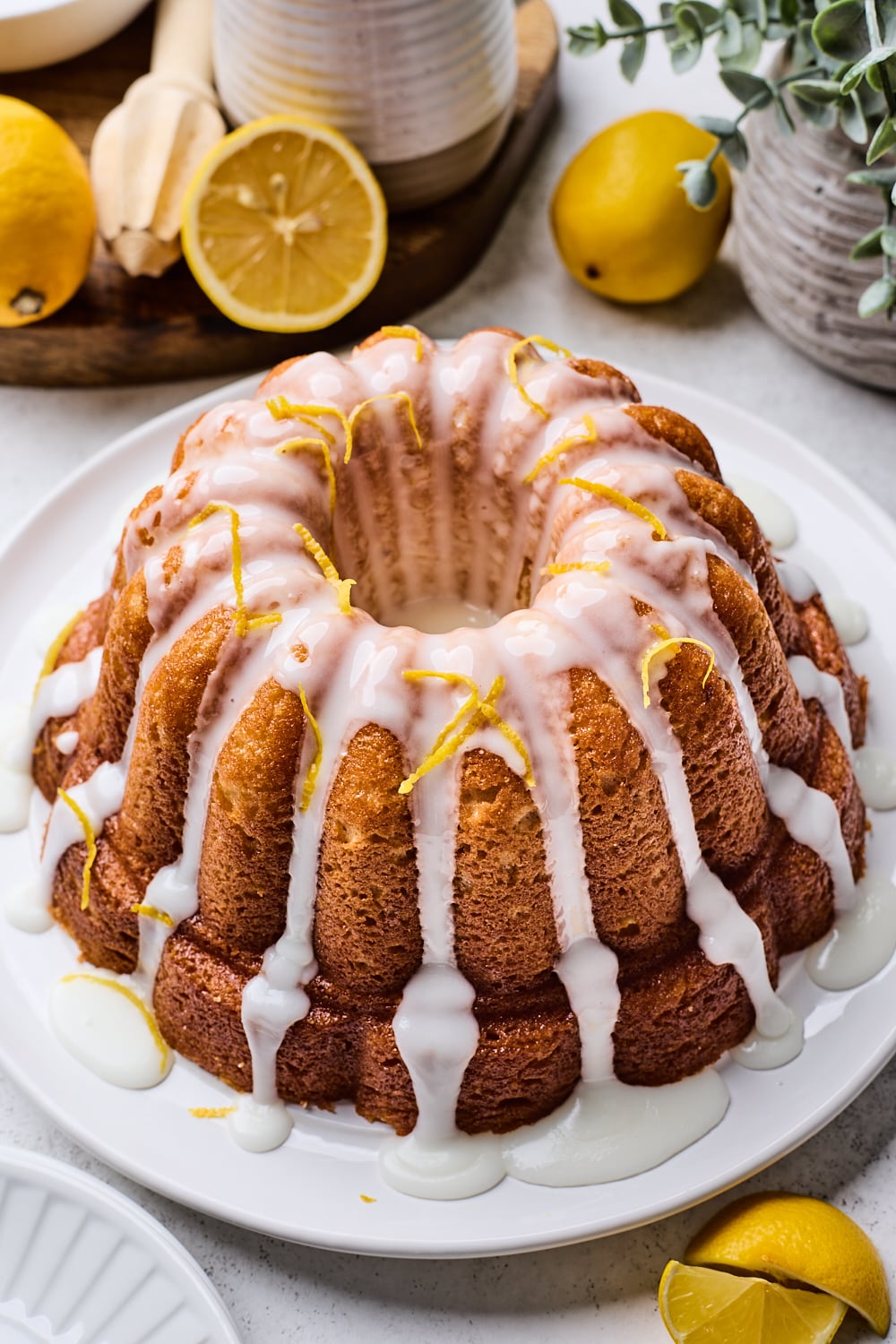 A Whole Lemon Bundt Cake with glaze on a table