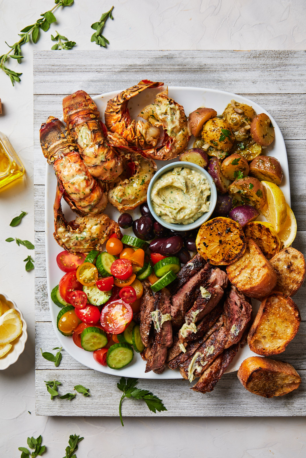 Grilled Lobster Tail and Steak Platter With a Greek Chimichurri Butter
