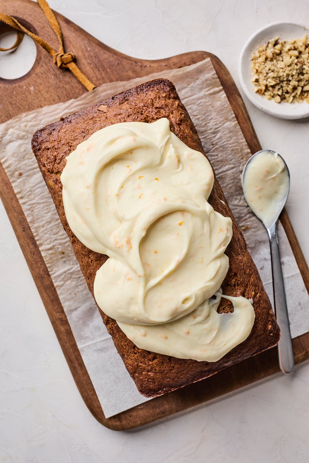 Spreading Frosting on Carrot Cake Loaf