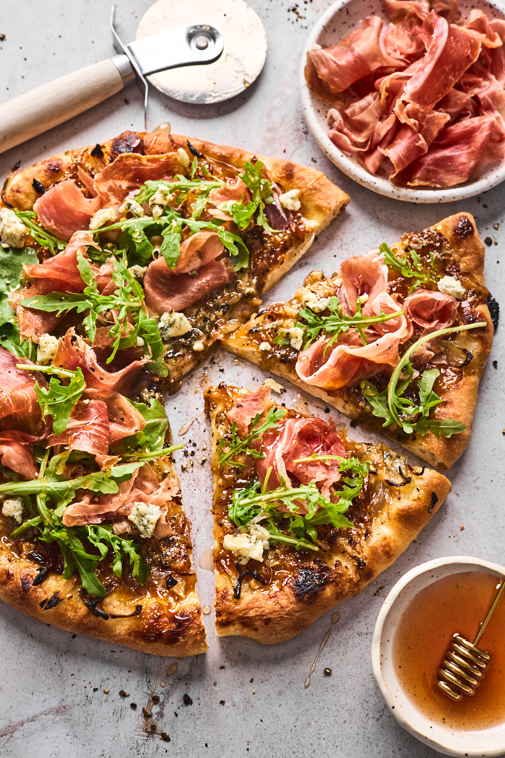 Fig Prosciutto Gorgonzola Arugula Pizza With Hot Honey