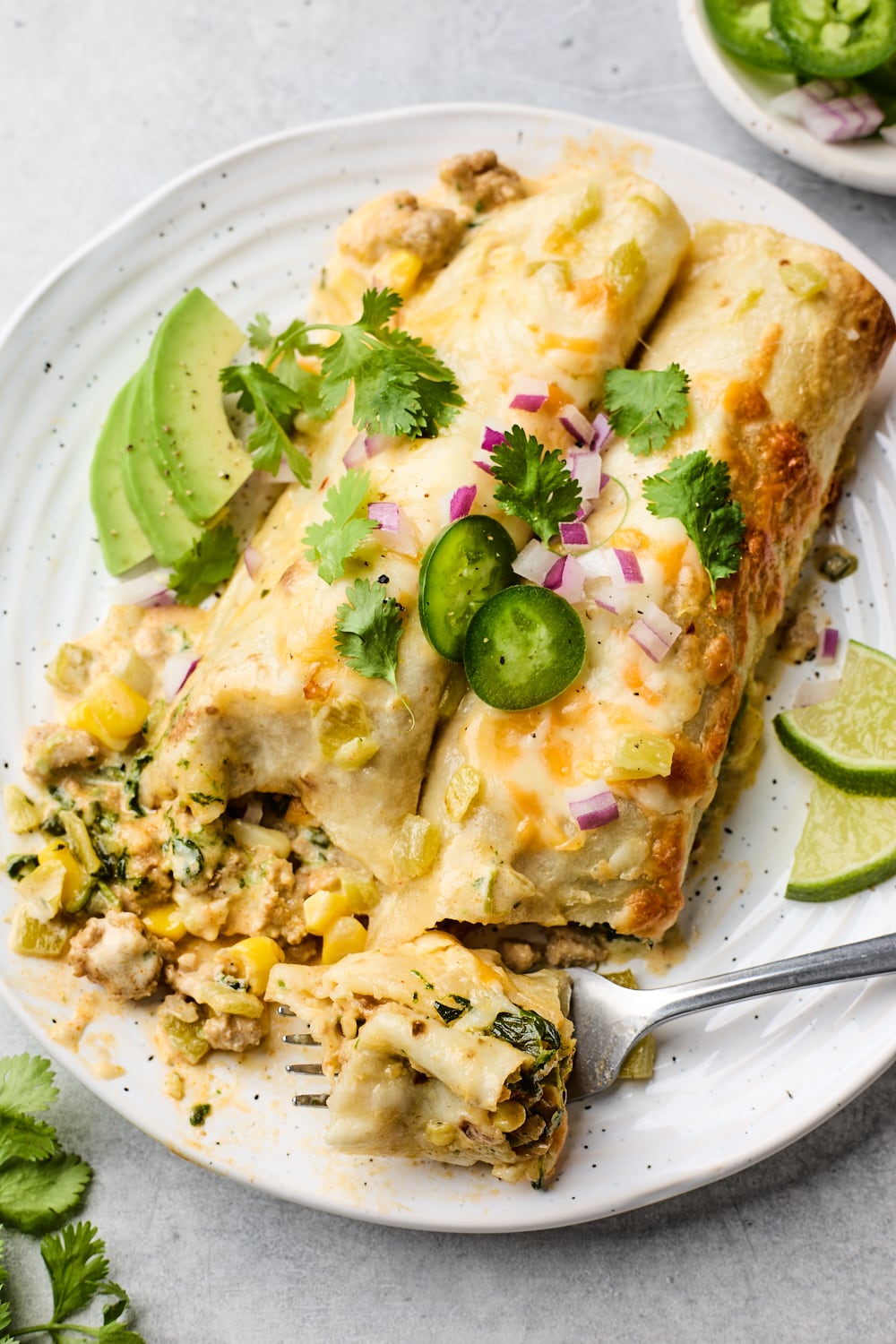 Green Chile Chicken Enchiladas on a plate