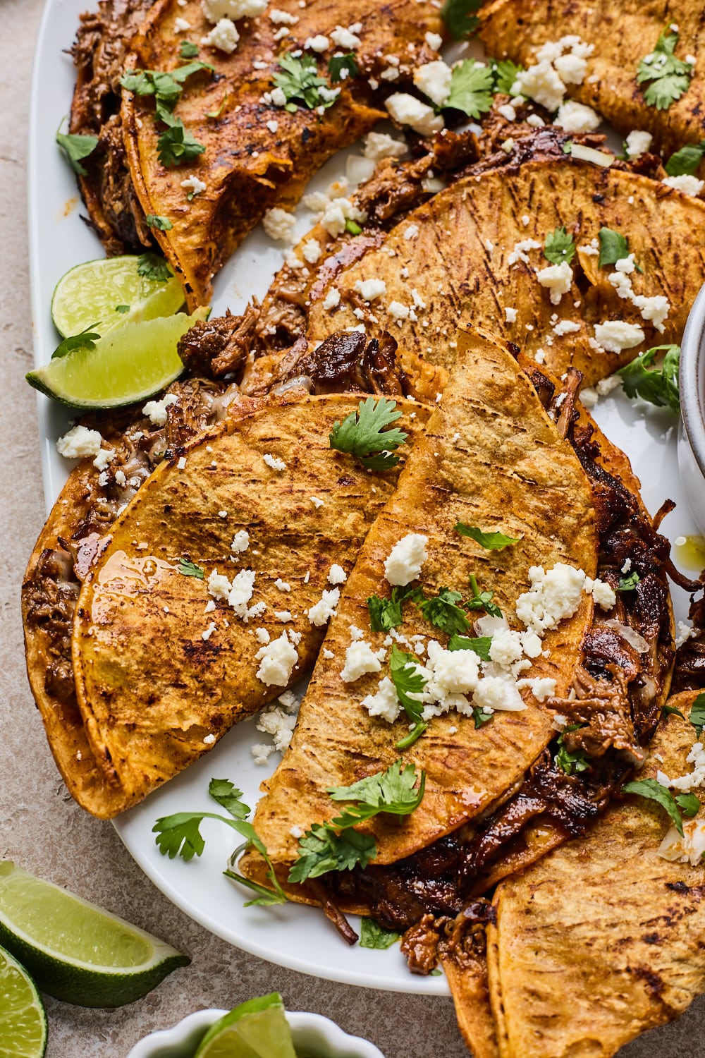 Simple Beef Birria in tacos on a plate